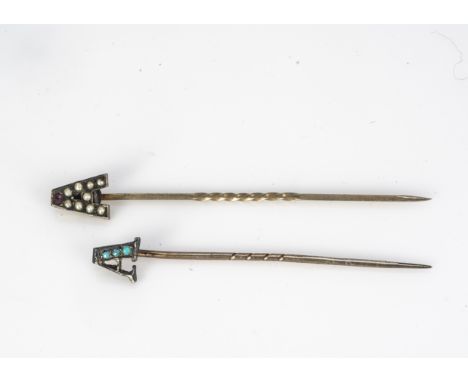 Two A terminating stick pins, one set with seed pearls and a red garnet, the other set with turquoise (2) 