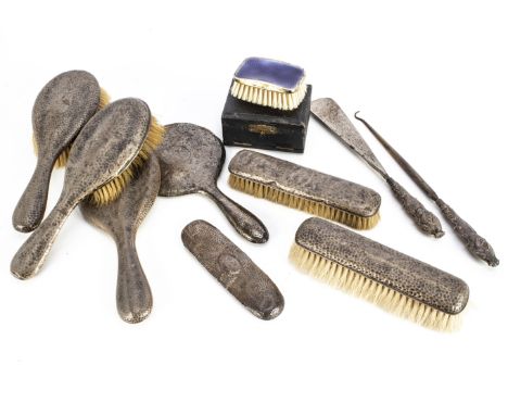 A group of dressing table items, including a silver gilt and enamel clothes brush in a box, together with a part hammered sil