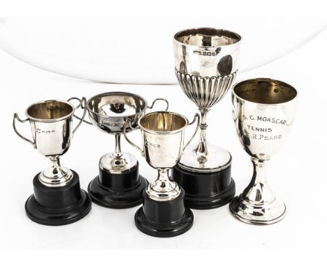 Five Victorian and early 20th century small silver trophy cups and goblets, four with stands, the tallest is 10cm (9) 