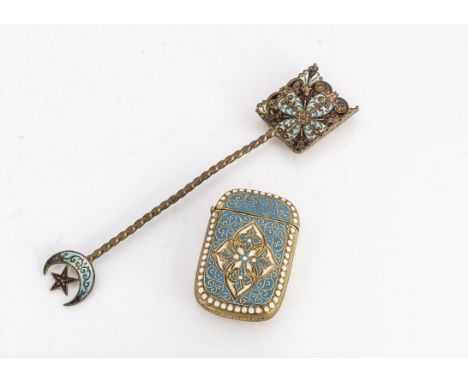 An early 20th century enamelled vesta case and spoon, the brass match case turquoise enamel and cream bead enamel border, the