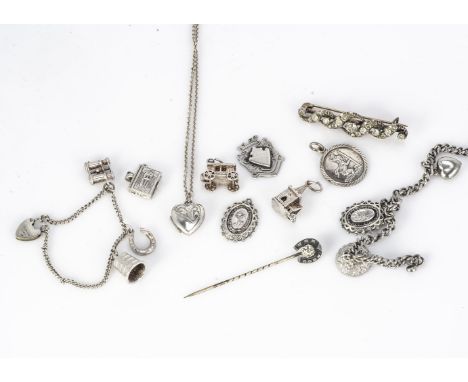 A French paste bar brooch, of scroll design, together with two silver charm bracelets, stick pin and other silver items 39g 