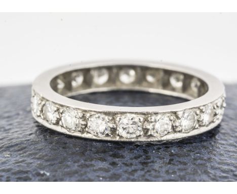 A white gold and diamond full eternity ring, the brilliant cuts in a channel setting, each measuring 0.007cts, ring size K, 3