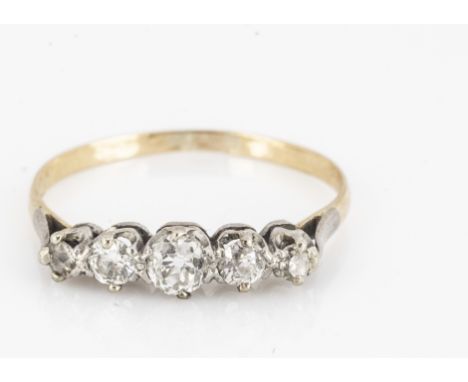 A five stone old cut diamond ring, the in white metal claw settings, on a yellow, metal shank, ring size R,  diamond weight 0