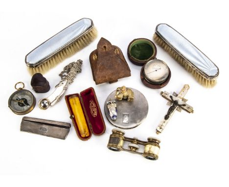 A small collection of works of art, including a silver compact and comb, a cased amber cigar holder, a boson's whistle, a cas