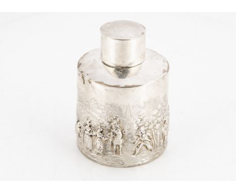 An Edwardian silver tea caddy by H.A, 9cm and 2.4 ozt, with raised decoration of figures in a landscape, some denting 