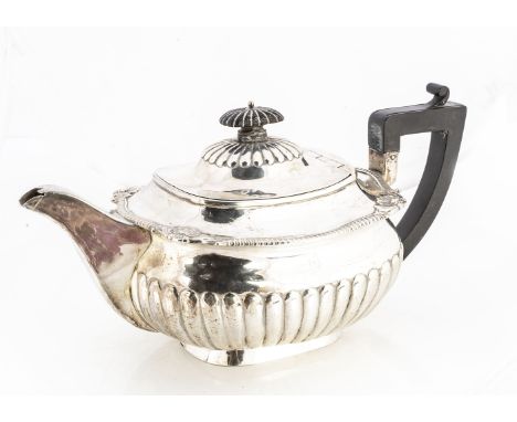 A George III silver teapot by Robert Hennell, London 1810, 20.45 ozt, fluted lower and applied handle and finial, handle appe