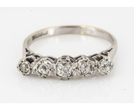 An 18ct white gold five stone diamond ring, the old cuts in illusion settings, total weight 0.28cts, ring size R, in a John E