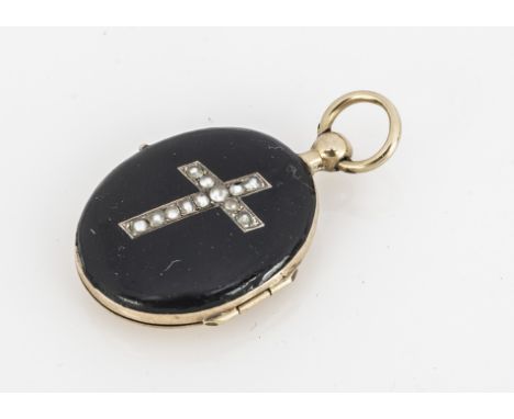 An oval black enamel and seed pearl yellow metal oval locket, having and engine turned back, oval cartouche marked Susan, 2.5