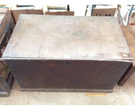 A 19th Century oak trunk, flanked by iron carrying handles, 85cm