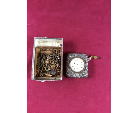 A silver cased travel clock, Birmingham 1897, white enamel dial, 7cm; and a collection of watch keys