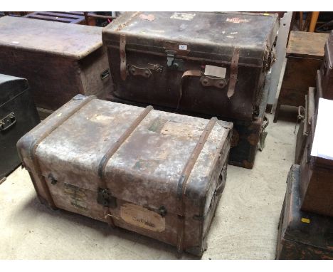 A vintage leather travelling trunk, with removable trays; a battened similar; and a metal bound trunk AF (3)