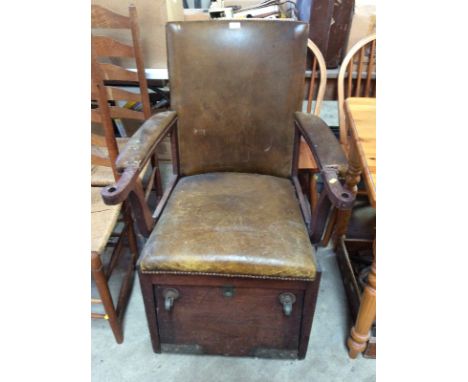 A rare and unusual late 19th Century mahogany invalid's chair; with leather upholstered back, seat and arm rests, drop down f