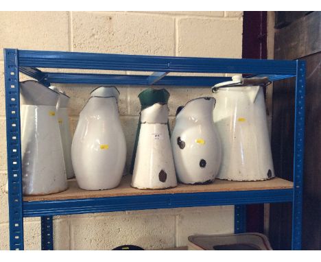 Seven various old enamel water jugs; an enamel pail; and a bed pan