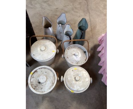 Four enamel wash jugs; and four china slops pails