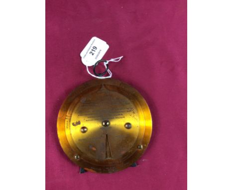 A lacquered barometer forecast dial, Negretti and Zambra, London, patent 62776 1915, on a strut support, 12cm dia.
