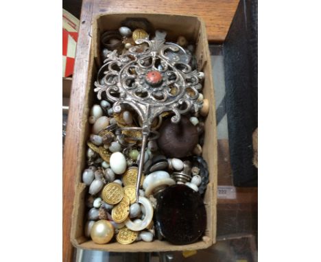 A white metal cloak pin, cast scroll decoration,15cm; various trade beads; gilt metal items etc.