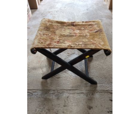 A painted pine trunk, of small proportions, 57cm wide; and an Edwardian folding stool with carpet style upholstery