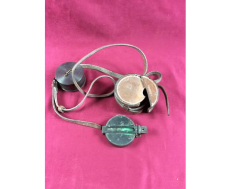 A metal cased marching compass, C. Owen Optician, 46 & 48 City Road, London, instrument casing with a leather case