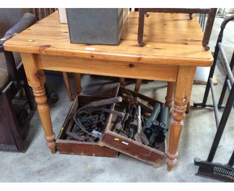 A pine kitchen table; and three stick back kitchen chairs, (4)