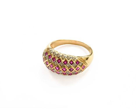 A Synthetic Ruby and Diamond Cluster Ring, stamped '750', finger size T1/2Gross weight 6.6 grams.