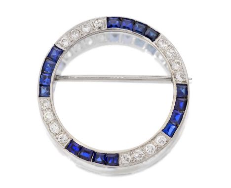 A Synthetic Sapphire and Diamond Brooch, the circular frame comprising of calibré cut synthetic sapphire sections alternating