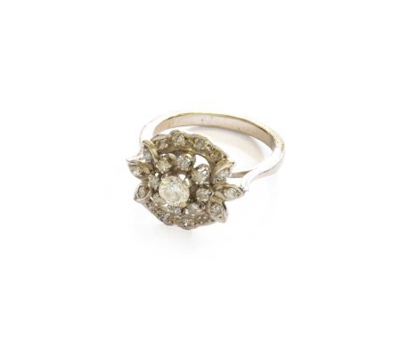 A Diamond Cluster Ring, finger size MIndistinctly marked to the outside of the shank. Gross weight 4.7 grams.