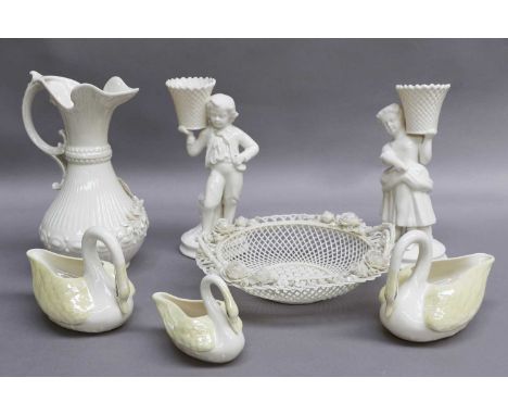 A Small Group of Belleek China, comprising a ewer, a pair of figural candlesticks, a twin handled basket and a set of three g