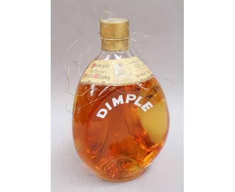 A Bottle Of Dimple Old Blended Scotch Whisky, 1960s bottling, 70º proof, 26 2/3 fl. ozs. (one bottle)Level - top shoulder. Wi