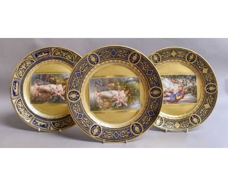 A Set of Three Vienna Porcelain Cabinet Plates, each painted with a figural panel to the center within heavily gilt and cobal