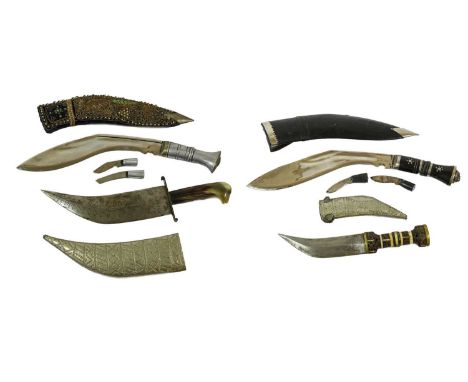 An Indian Kukri, with aluminium grip, two sharpening knives and blue velvet scabbard with raised gold bullion thread embroide