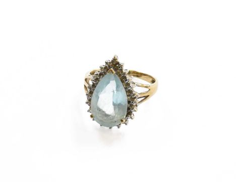 A Blue Topaz and Diamond Cluster Ring, stamped '375', finger size KGross weight 3.6 grams.