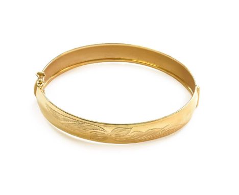 A Hinged Bangle, stamped '750', inner measurements 6.3cm by 5.2cmGross weight 13.5 grams. The bangle is stamped 750.