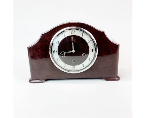 A large bakelite and chrome striking mantle clock, W. 37cm. H. 23cm.
