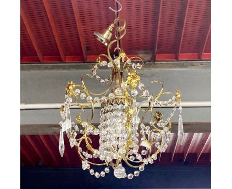 A pair of chandelier light fittings, longest drop H. 30cm, with a further single chandelier.
