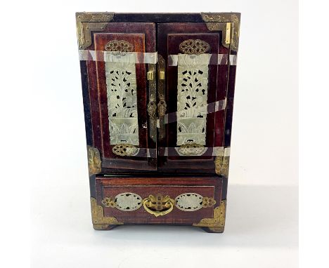 A Chinese hardwood miniature cabinet inset with carved jade, H. 32cm. W. 20cm. D. 15cm.