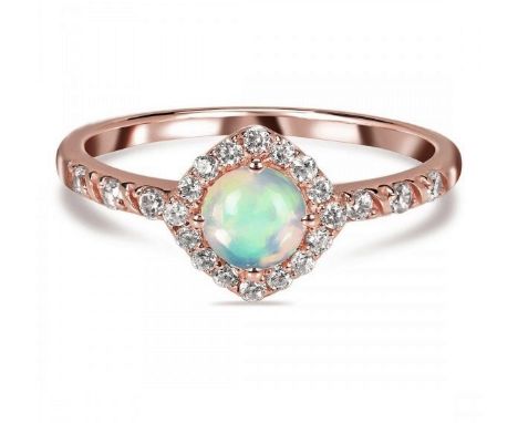 A rose gold on 925 silver ring set with a cabochon cut opal and white stones.