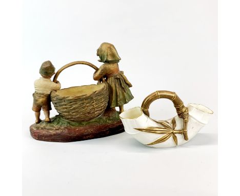 A Royal Worcester porcelain bamboo shaped basket together with a 19th century hand painted terracotta figure of a boy and gir