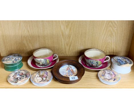 A group of 19th century Prattware pot lids with two cups and saucers.