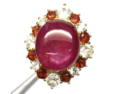 A 925 silver ring set with a large cabochon cut ruby surrounded by rubies and white stones, (N).