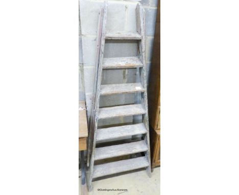   A vintage painted seven tread pine step ladder, height 161cm