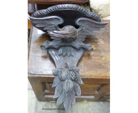   A Black Forest carved oak eagle wall bracket, width 47cm, height 56cm