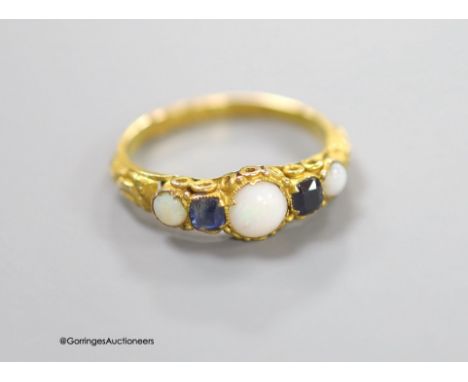   A Victorian 15ct gold, three stone white opal and two stone sapphire set half hoop ring, size L/M, gross 1.4 grams.