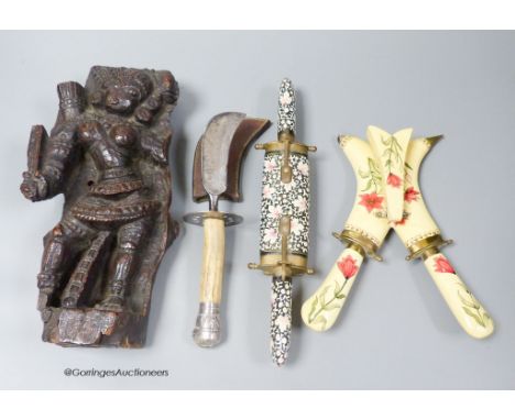   An Indian hardwood figural relief, 18th century or earlier, 28cm, a dagger and two carving knife sets