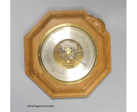  A Mouseman octagonal oak aneroid barometer, 21cm