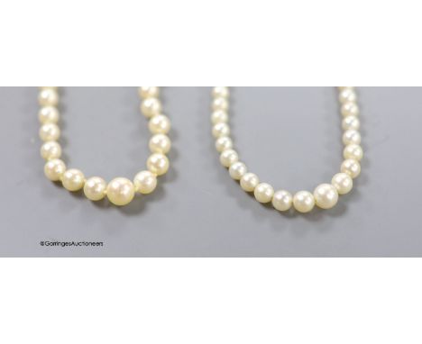   Two single strand graduated cultured pearl necklaces, one with 14k white metal clasp,45cm, the other with 9ct white metal c