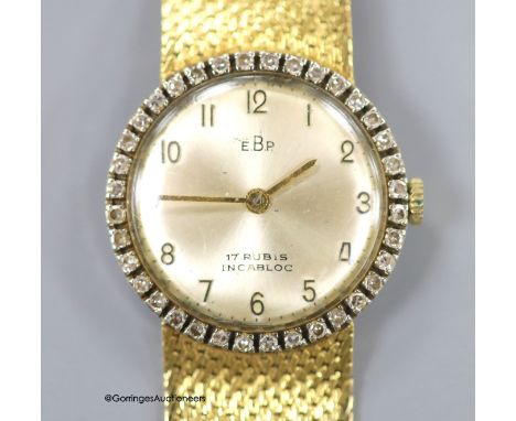   A lady's 18k and diamond set EBP manual wind wrist watch on an integral 750 mesh link bracelet, overall 19.5cm, gross weigh