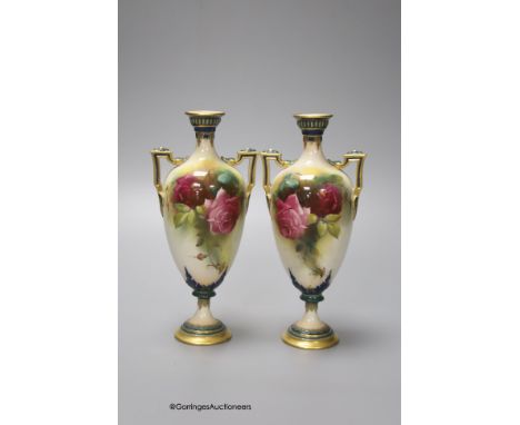   A pair of Royal Worcester two handled vases, decorated with roses, unsigned, 18cm (one a.f.)
