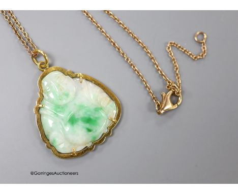   A yellow metal mounted jade pendant, carved as a Buddha, 30mm on a 925 chain.