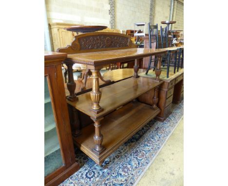   A late Victorian oak three tier buffet, length 136cm, depth 54cm, height 140cm