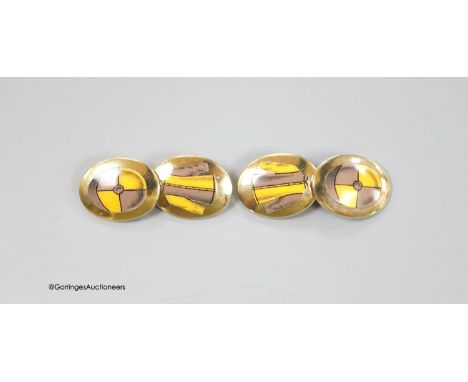   A cased modern pair of silver gilt and enamel Longmire oval cufflinks, decorated with jockey cap and colours, 19mm, gross w